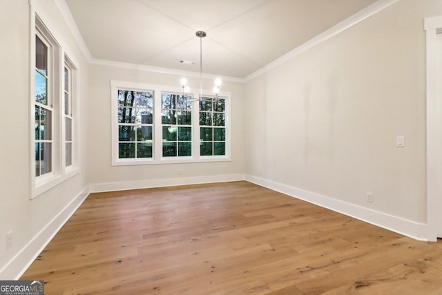 117 Wildwood Dr, Eatonton, GA 31024 - unfurnished dining area with light wood-type flooring, baseboards, and ornamental molding