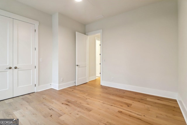 117 Wildwood Dr, Eatonton, GA 31024 - unfurnished bedroom with light wood-type flooring and baseboards