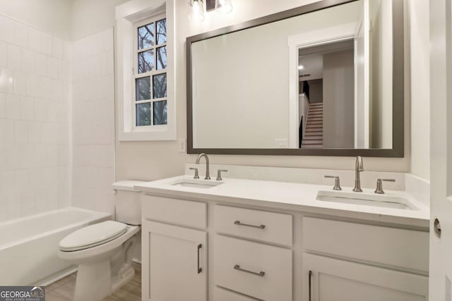 117 Wildwood Dr, Eatonton, GA 31024 - bathroom with washtub / shower combination, double vanity, toilet, and a sink