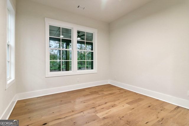 117 Wildwood Dr, Eatonton, GA 31024 - spare room with light wood-type flooring, visible vents, and baseboards