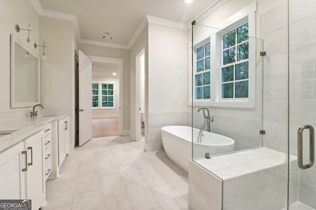 117 Wildwood Dr, Eatonton, GA 31024 - bathroom featuring a soaking tub, a stall shower, ornamental molding, and plenty of natural light