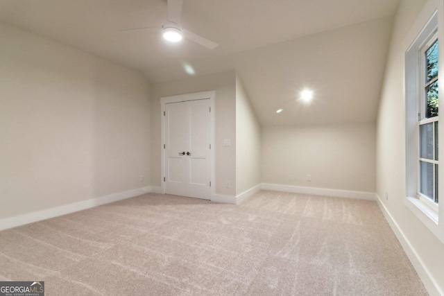 117 Wildwood Dr, Eatonton, GA 31024 - additional living space with light carpet, a ceiling fan, and baseboards