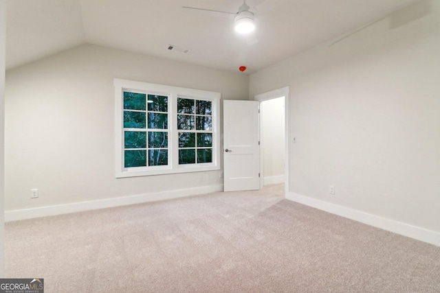 117 Wildwood Dr, Eatonton, GA 31024 - empty room featuring carpet floors, vaulted ceiling, visible vents, and baseboards