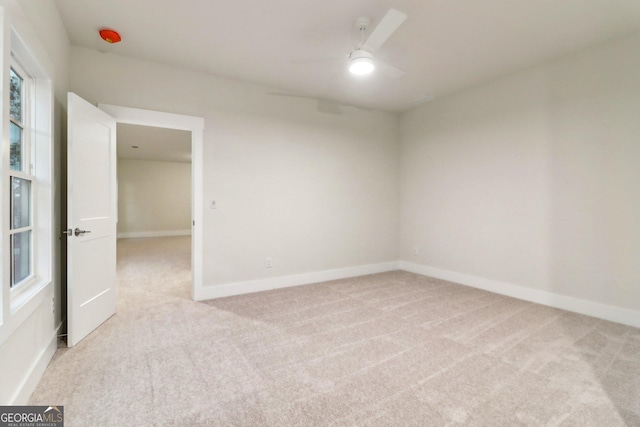 117 Wildwood Dr, Eatonton, GA 31024 - unfurnished room with light carpet, a ceiling fan, and baseboards