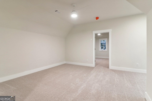117 Wildwood Dr, Eatonton, GA 31024 - additional living space featuring light carpet, vaulted ceiling, visible vents, and baseboards