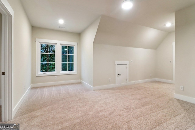 117 Wildwood Dr, Eatonton, GA 31024 - bonus room featuring light carpet, vaulted ceiling, baseboards, and recessed lighting