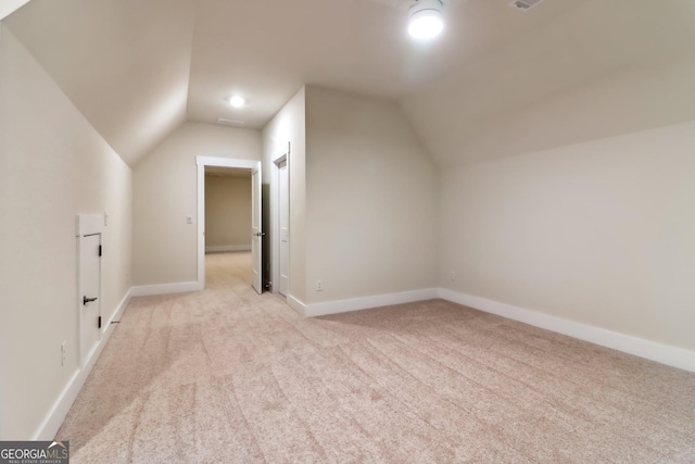 117 Wildwood Dr, Eatonton, GA 31024 - bonus room with lofted ceiling, baseboards, and light colored carpet