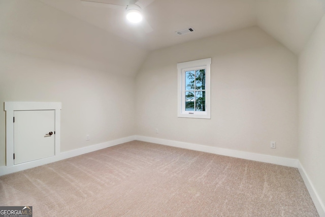 117 Wildwood Dr, Eatonton, GA 31024 - additional living space with lofted ceiling, baseboards, visible vents, and light colored carpet