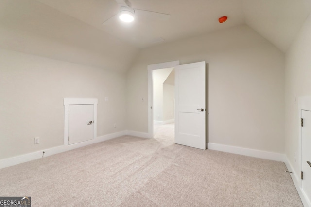117 Wildwood Dr, Eatonton, GA 31024 - additional living space with lofted ceiling, a ceiling fan, baseboards, and light carpet