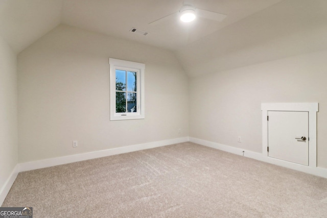 117 Wildwood Dr, Eatonton, GA 31024 - additional living space with lofted ceiling, visible vents, and light carpet
