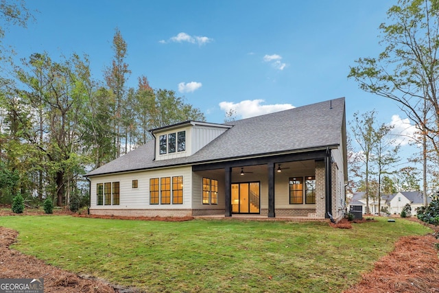 117 Wildwood Dr, Eatonton, GA 31024 - back of house with brick siding, a ceiling fan, a lawn, and cooling unit