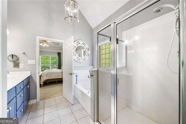 204 Overland Trl, Mcdonough, GA 30252 - ensuite bathroom featuring a shower stall, vaulted ceiling, a bath, ensuite bath, and tile patterned flooring