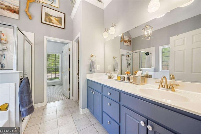 204 Overland Trl, Mcdonough, GA 30252 - bathroom featuring a shower stall, tile patterned floors, a sink, and double vanity