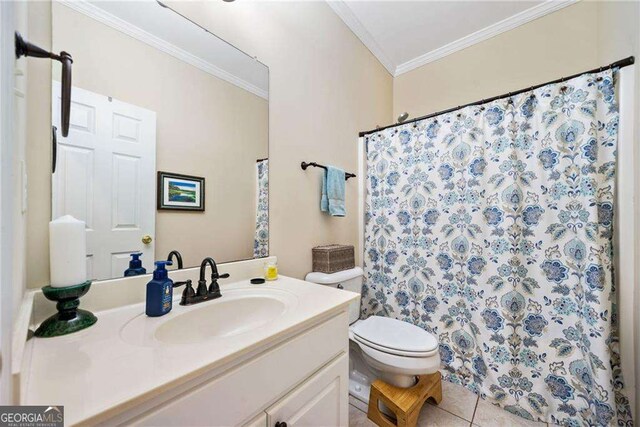 204 Overland Trl, Mcdonough, GA 30252 - bathroom with vanity, toilet, ornamental molding, tile patterned flooring, and a shower with shower curtain