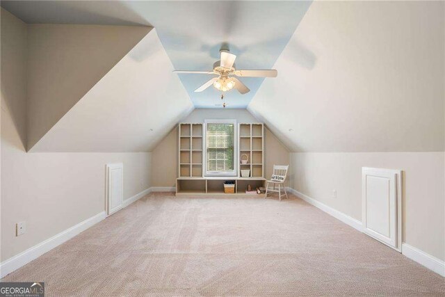 204 Overland Trl, Mcdonough, GA 30252 - additional living space featuring baseboards, vaulted ceiling, ceiling fan, and carpet