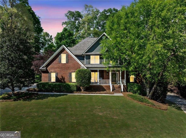 204 Overland Trl, Mcdonough, GA 30252 - view of front of property with brick siding, a front lawn, and covered porch