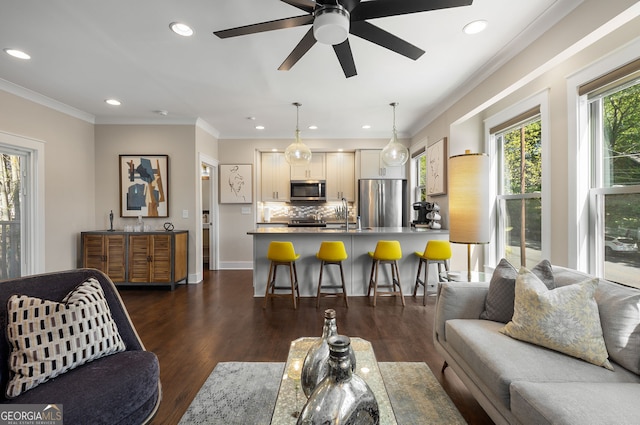 738 Saint Charles Ave NE, Atlanta, GA 30306 - living room featuring dark wood-style floors, recessed lighting, ceiling fan, and crown molding