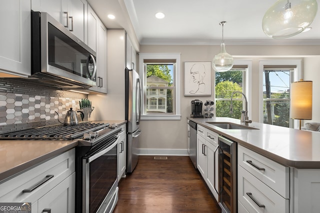 738 Saint Charles Ave NE, Atlanta, GA 30306 - kitchen with wine cooler, a sink, baseboards, decorative backsplash, and appliances with stainless steel finishes