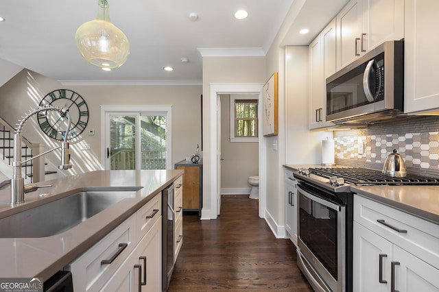 738 Saint Charles Ave NE, Atlanta, GA 30306 - kitchen featuring backsplash, plenty of natural light, stainless steel appliances, and a sink