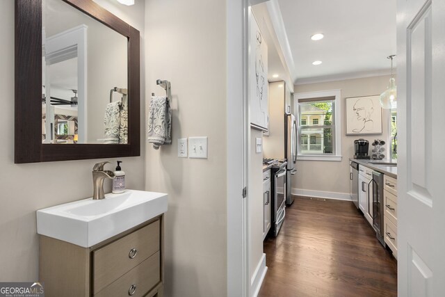 738 Saint Charles Ave NE, Atlanta, GA 30306 - interior space with baseboards, wood finished floors, vanity, and ornamental molding