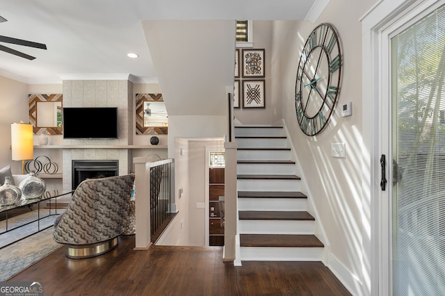 738 Saint Charles Ave NE, Atlanta, GA 30306 - staircase featuring a tile fireplace, wood finished floors, ceiling fan, and plenty of natural light
