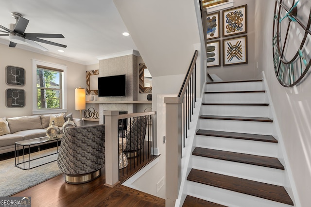 738 Saint Charles Ave NE, Atlanta, GA 30306 - stairway featuring recessed lighting, a ceiling fan, wood finished floors, a fireplace, and ornamental molding