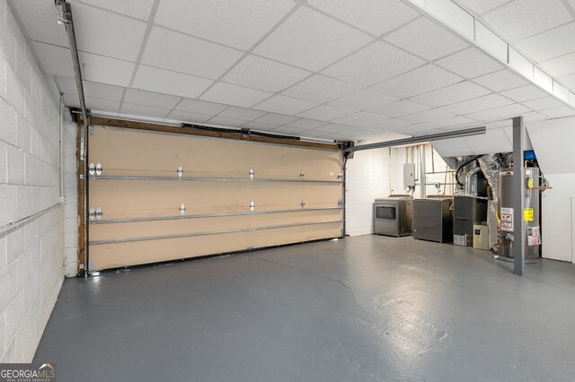 738 Saint Charles Ave NE, Atlanta, GA 30306 - garage featuring water heater, independent washer and dryer, concrete block wall, and heating unit