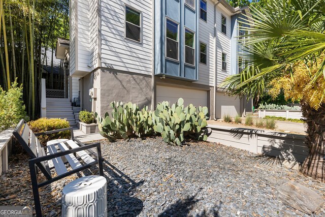 738 Saint Charles Ave NE, Atlanta, GA 30306 - exterior space featuring stucco siding and an attached garage