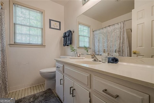 5251 Amberbrook Ct, Marietta, GA 30068 - bathroom featuring tile patterned flooring, baseboards, toilet, and vanity