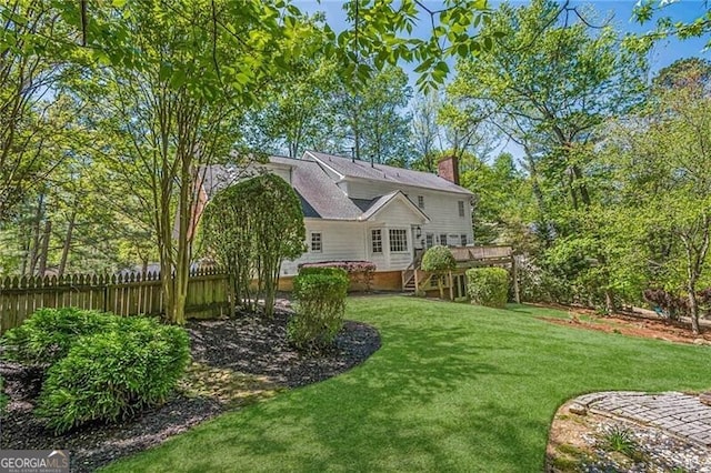 5251 Amberbrook Ct, Marietta, GA 30068 - rear view of house featuring a lawn, a wooden deck, fence, and a chimney