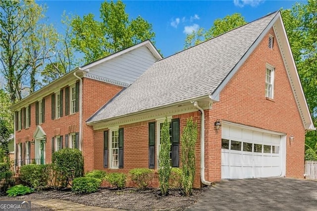 5251 Amberbrook Ct, Marietta, GA 30068 - view of side of property featuring driveway, brick siding, and a garage