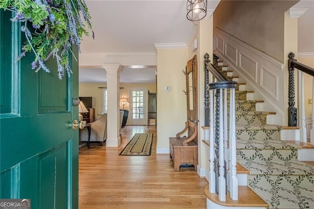 5251 Amberbrook Ct, Marietta, GA 30068 - entryway featuring stairway, crown molding, light wood-style floors, and ornate columns
