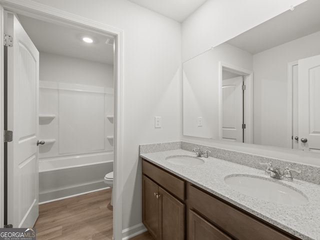 131 Hampton Ter, Dallas, GA 30157 - full bath featuring toilet, wood finished floors, a sink, and double vanity