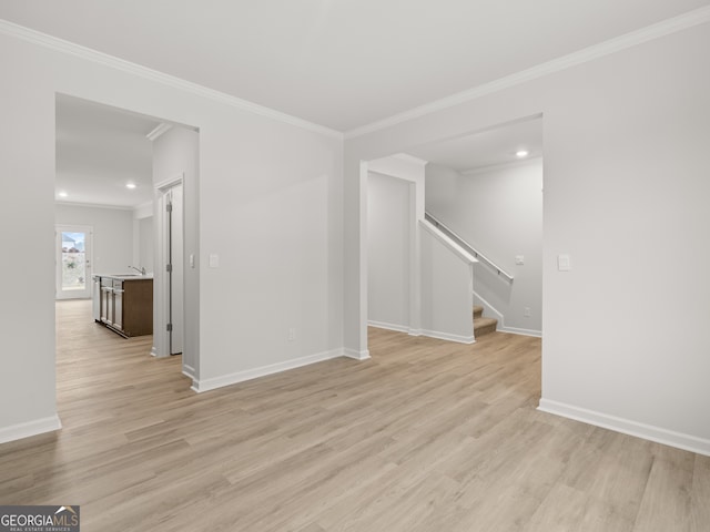 131 Hampton Ter, Dallas, GA 30157 - unfurnished room featuring baseboards, ornamental molding, stairs, and light wood finished floors