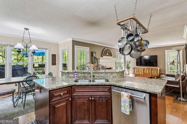 5876 Bridgemont Pl NW, Acworth, GA 30101 - kitchen featuring dishwasher, a sink, a textured ceiling, open floor plan, and a notable chandelier
