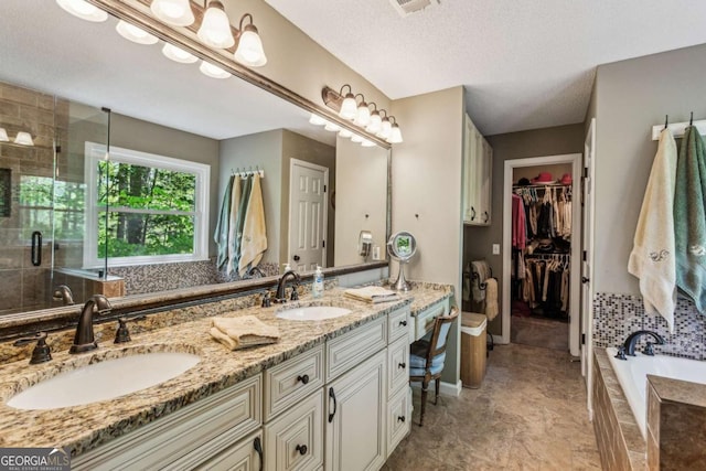 5876 Bridgemont Pl NW, Acworth, GA 30101 - full bathroom with a shower stall, double vanity, a garden tub, and a sink