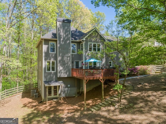 5876 Bridgemont Pl NW, Acworth, GA 30101 - rear view of property with a chimney, fence, central AC, french doors, and a deck