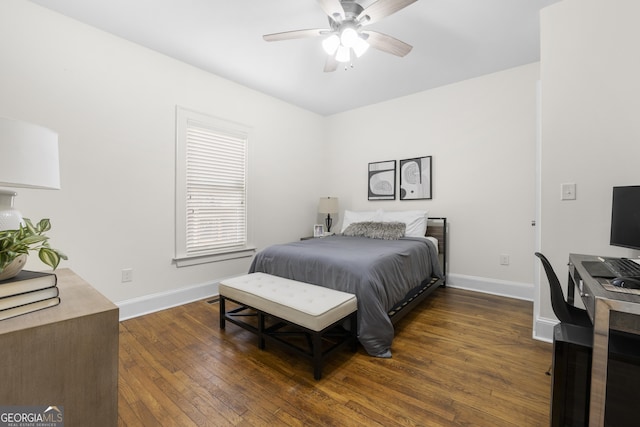 bedroom featuring ceiling fan, baseboards, and dark wood-type flooring