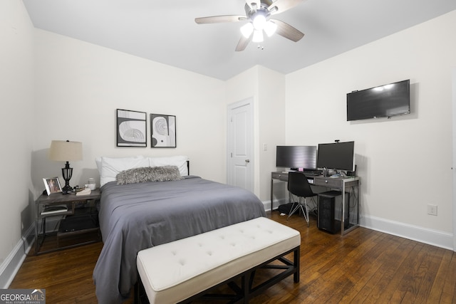 bedroom featuring a ceiling fan, baseboards, and wood-type flooring