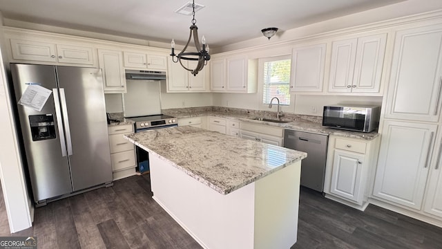 kitchen featuring a sink, appliances with stainless steel finishes, visible vents, under cabinet range hood, and dark wood-style floors