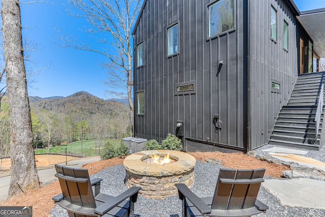 631 Bent Grass, Clayton, GA 30525 - view of patio / terrace with a fire pit, a mountain view, and stairs