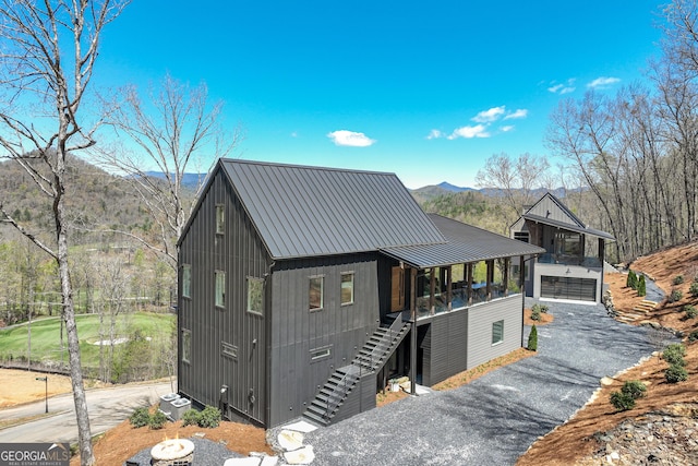 631 Bent Grass, Clayton, GA 30525 - view of front of property with stairs, a standing seam roof, a mountain view, metal roof, and cooling unit