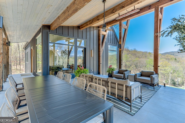 631 Bent Grass, Clayton, GA 30525 - view of patio / terrace with outdoor dining area, an outdoor living space, and a wooded view