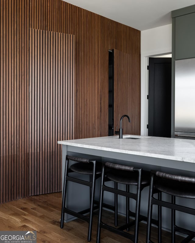 631 Bent Grass, Clayton, GA 30525 - kitchen featuring a sink, light countertops, and a breakfast bar