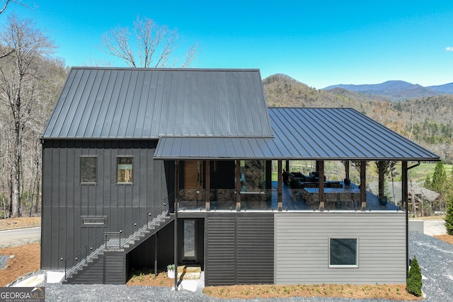 631 Bent Grass, Clayton, GA 30525 - rear view of property featuring stairs, a mountain view, a standing seam roof, and metal roof