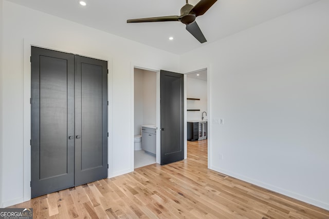 631 Bent Grass, Clayton, GA 30525 - unfurnished bedroom with light wood finished floors, recessed lighting, baseboards, ensuite bathroom, and ceiling fan