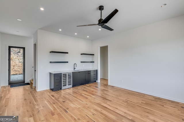 631 Bent Grass, Clayton, GA 30525 - indoor wet bar with wine cooler, ceiling fan, light wood-type flooring, recessed lighting, and baseboards