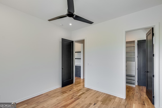 631 Bent Grass, Clayton, GA 30525 - unfurnished bedroom featuring a spacious closet, light wood finished floors, recessed lighting, baseboards, and a closet