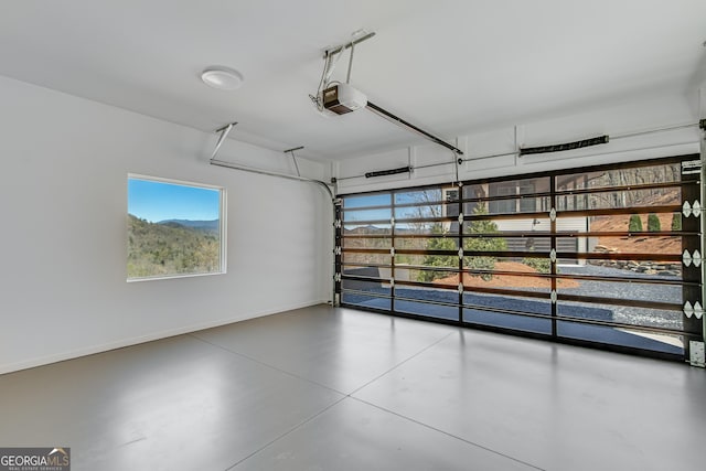 631 Bent Grass, Clayton, GA 30525 - garage with a garage door opener and baseboards