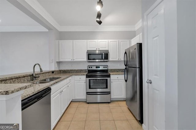 1850 Cotillion Dr Unit 4204, Dunwoody, GA 30338 - kitchen with white cabinets, stainless steel appliances, a sink, light tile patterned floors, and ornamental molding